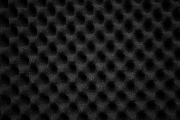 Texture soundproof panel of polyurethane foam. Abstract black rubber foam background.