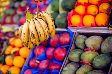 Colorful organic fruits in the marketplace. Bright summer background. Healthy food. Natural nutrition for diet.