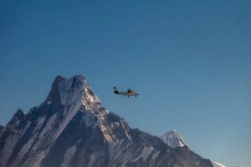 Small Airplane Flying Over Himalayan Mountain Range