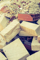 Background of building rubble with terracotta bricks and other white stone bricks very famous in Sicily.