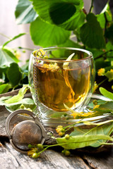 Linden flowers and cup of healthy tea
