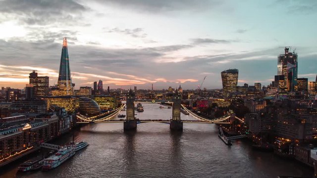 Aerial drone Tower Bridge London city skyline and Shard Bulding time lapse hyperlapse of the Thames river at dusk sunset