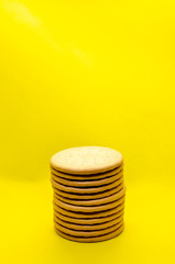 stack of cookies on a yellow background