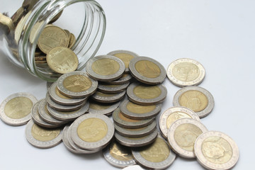 Saving the Coins of thailand on a white background