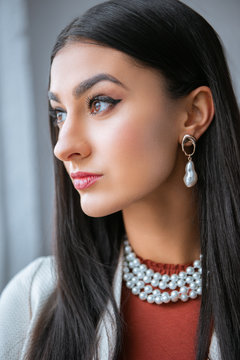 close-up portrait of beautiful elegant young brunette woman looking away