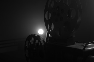 Vintage movie projector. Film reels. Black and white. Still life, close-up
