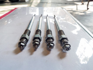 Parts of the car are placed on a white background.