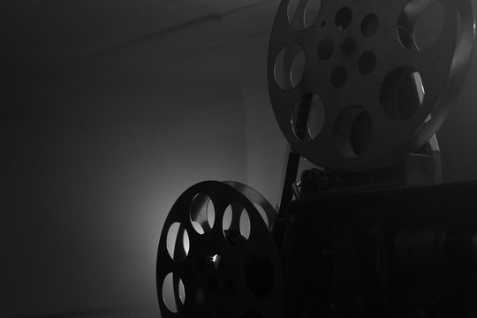 Vintage movie projector. Film reels. Black and white. Still life, close-up