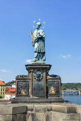Fototapeta premium Sculpture of St. John of Nepomuk on the Charles Bridge in Prague