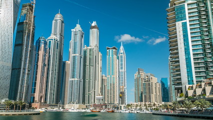 Fototapeta na wymiar View of Dubai Marina modern Towers in Dubai at day time timelapse