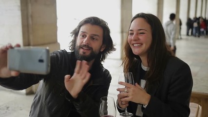 Young lovers having video call through smartphone.