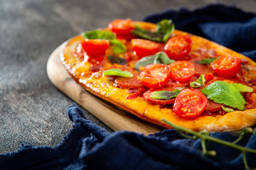 Sausage Pizza with Ham and tomatoes