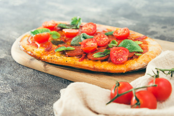 Sausage Pizza with Ham and tomatoes