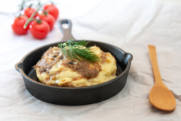 Dish made with cooked duck meat, dehydrated potato, fresh cream of mushroom and cheese