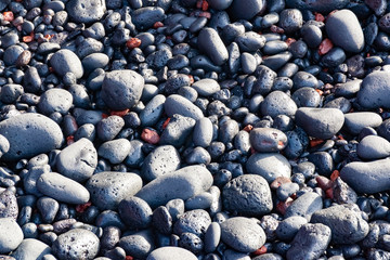 Black vulcanic stones on a black sand beach as a background, El Golfo, Lanzarote, Canary Islands, Spain
