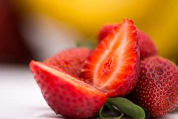 The ripe and red strawberries on the table