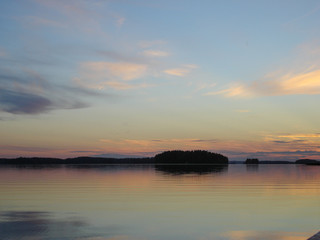 Fototapeta na wymiar Sunset landscape of Kuopio lakes reflection on the water and nice colors