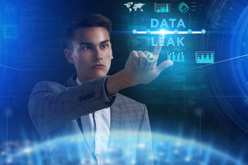 The concept of business, technology, the Internet and the network. A young entrepreneur working on a virtual screen of the future and sees the inscription: Data leak