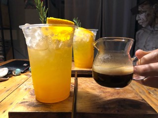 Espresso mixed with soda and orange juice