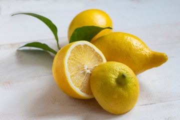 a bunch of fresh ripe juicy lemons on a table