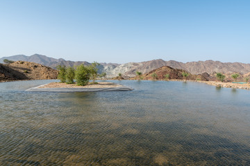 Manmade pond in Hatta, an enclave of the emirate of Dubai in the Hajar Mountains, United Arab Emirates.