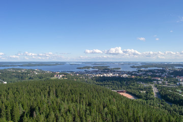Fototapeta premium Landscape of Kuopio from a tower in a sunny day at summer full of nature