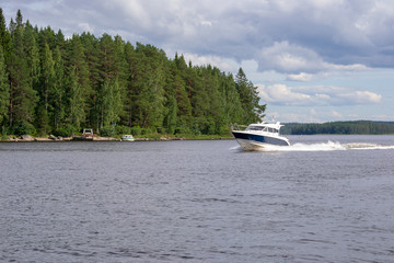 Landscape of a lake with a speed boat