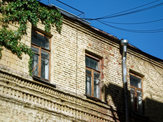 old brick house in summer in Moscow