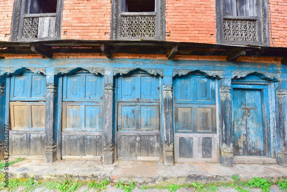 Wall mural old wooden doors at bundipur village in nepal