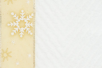 Christmas gold ribbon on white chevron textured fabric background