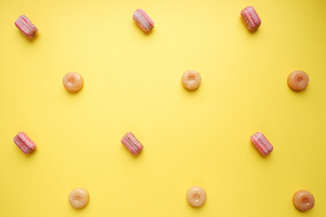Pattern of caramel sweets. Candy yellow background