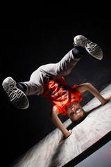 Young russian bboy doing some stunts on the stage