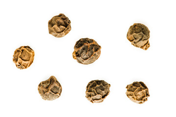 image of black pepper seeds on white background. Close-up image of black pepper on white background