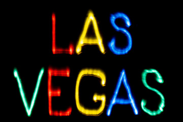 Light painting. City name. LAS VEGAS. Blue, yellow, green and red colors.