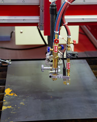 CNC gas plasma cutting machine cutting metal sheet. Industrial metalworking manufacturing