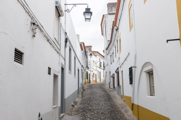 Fototapeta na wymiar Narrow cobble-stoned street in Évora, Portugal