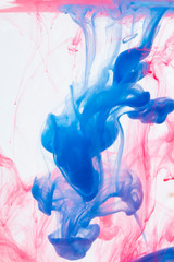Color drop in water on a white background close-up, abstraction