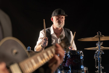 Guitarist and drummer play music