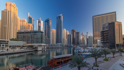 Fototapeta premium Morning view of Dubai Marina Towers and canal in Dubai timelapse
