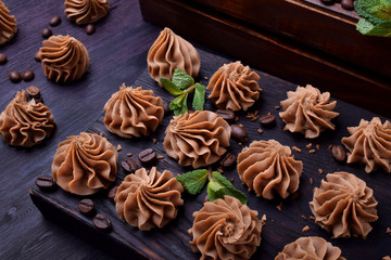 Coffee creamy fudge on a dark wooden board