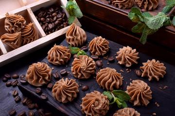 Coffee creamy fudge on a dark wooden board