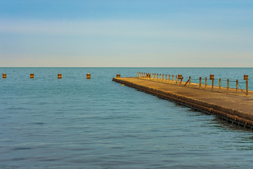 Fototapeta na wymiar Lake Michigan Pier with Afternoon Sunlight in Chicago