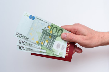 Russian international passport with euro in the man's hand. White background