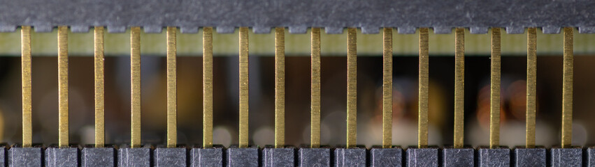 Close up (Macro) of Printed Circuit Board PCB embedded components (inductors, resistors, capacitors, diodes, microchips, transistor) with short depth of view.