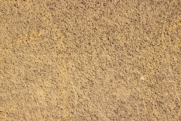 Facade wall yellow surface texture close up