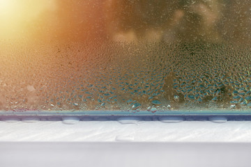 window with water drops closeup, inside, condensation - obrazy, fototapety, plakaty