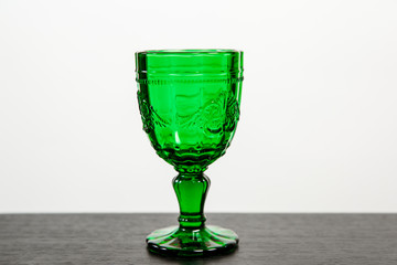 Glass with green drink.