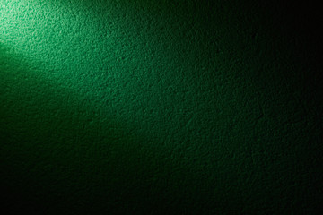 A beam of light on a color wall