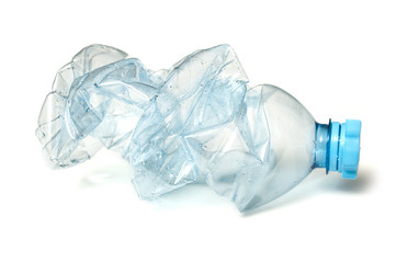 closeup of plastic bottle crushed for recycling on white background