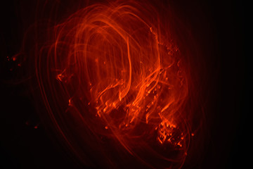 fire flames with sparks on a black background, abstract